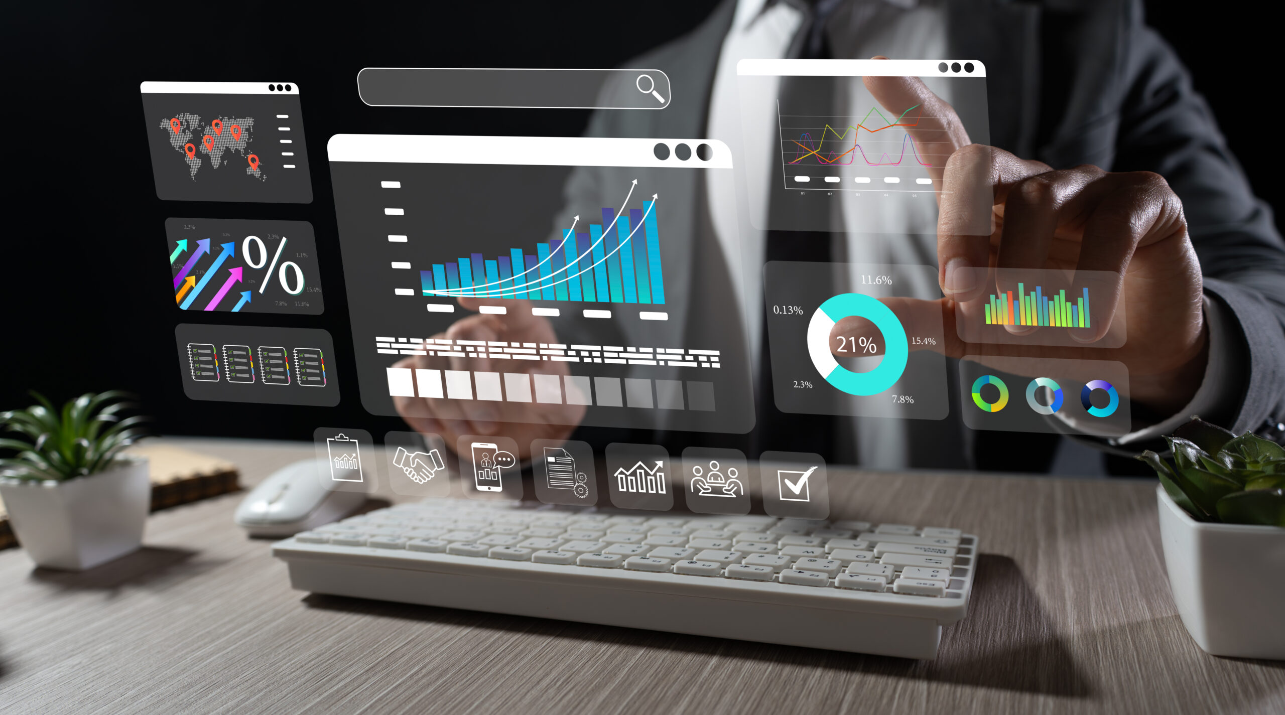 Executive analyzing strategies with hologram: businessman in dark office interacting with corporate data and graphics